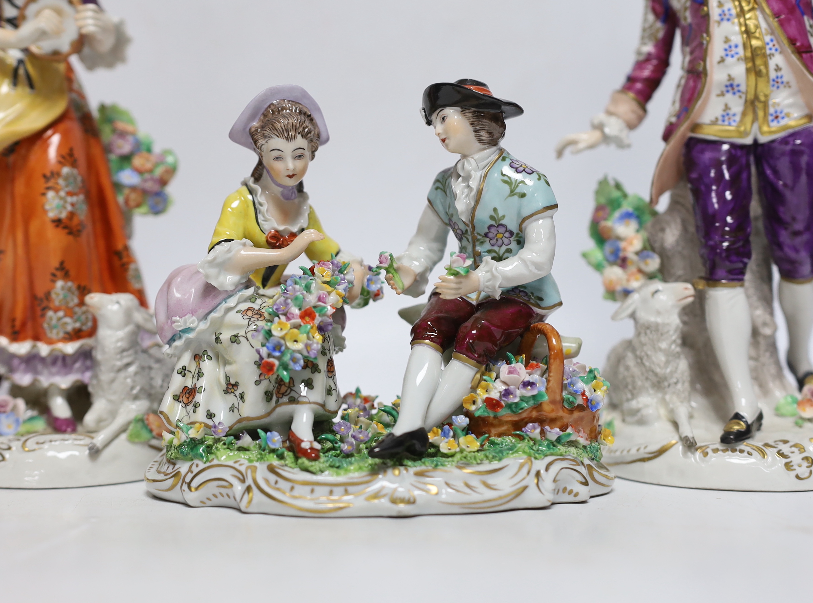 Four Sitzendorf porcelain figures in groups, early 20th century, 26cm